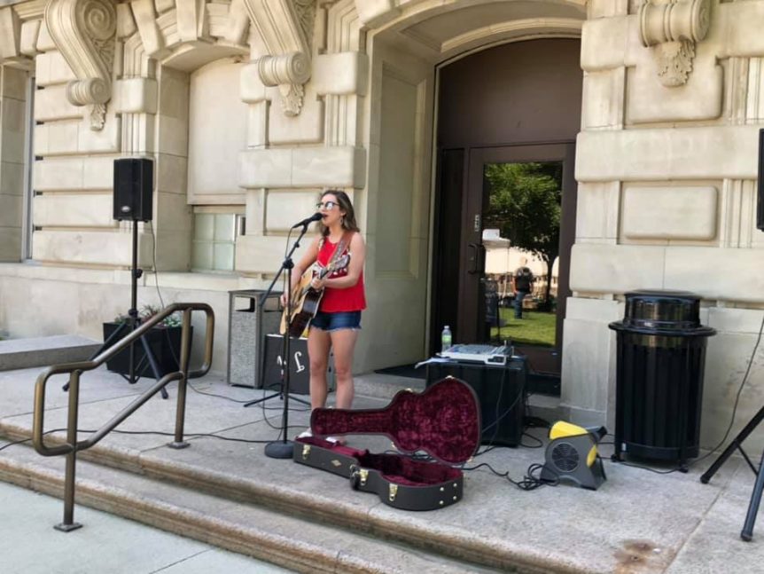 Person playing guitar at Jefferson Reunion Rendezvous